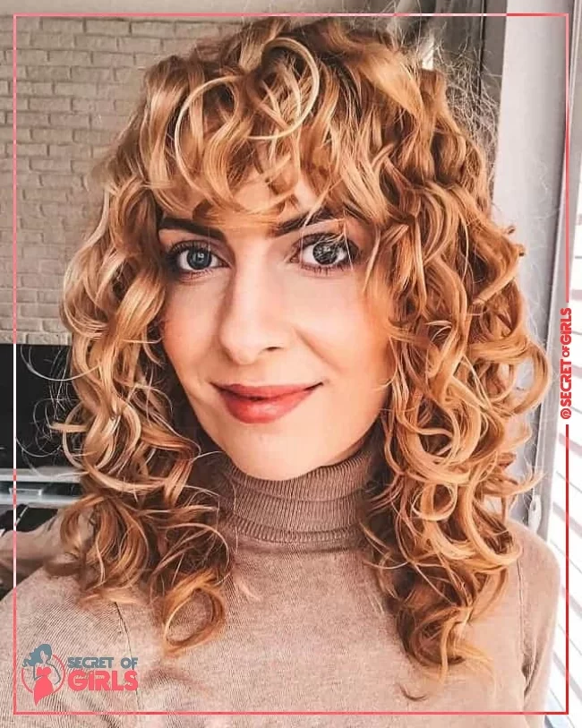23. Blonde Curly Hair with Bangs | 35 Most Flattering Curly Blonde Hairstyles
