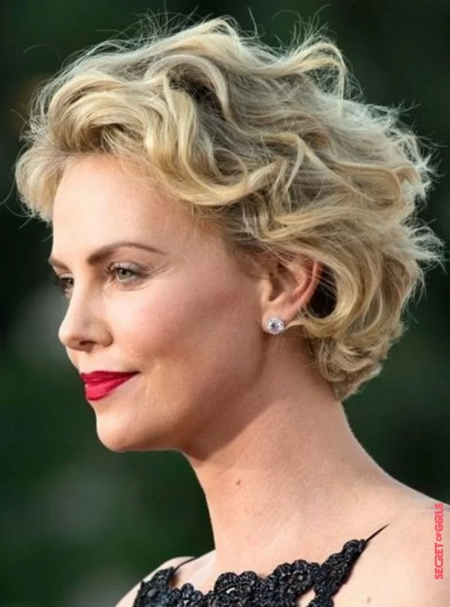 A short haircut styled back like Charlize Theron | Curly Hairstyles Trends 2023