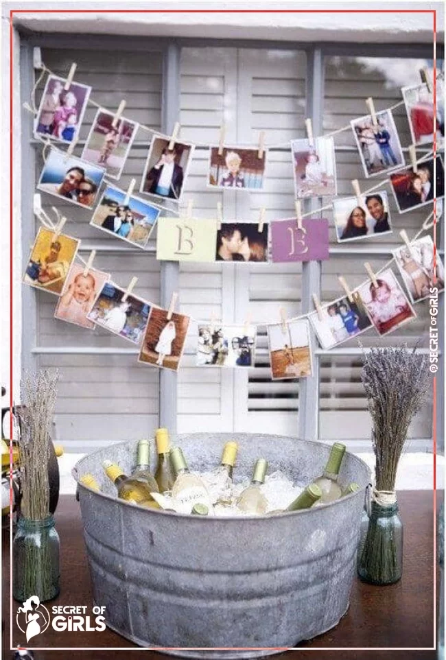 Wine Bucket with DIY Clothespin Photo Display | 25 Amazing DIY Engagement Party Decoration Ideas