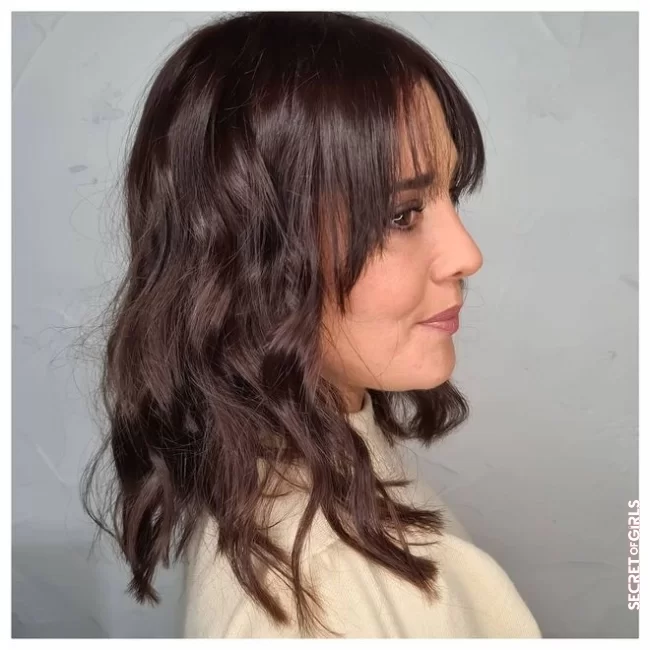 Curtain bangs on curly hair are possible!