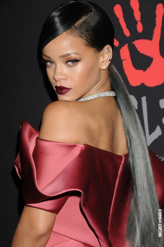 Maxi ponytail, long-stranded lock, and mat wine-red lipstick, for the Diamond Bal in 2014 | Rihanna's All Hairstyles So Far - Discover Rihanna's Hair Evolution