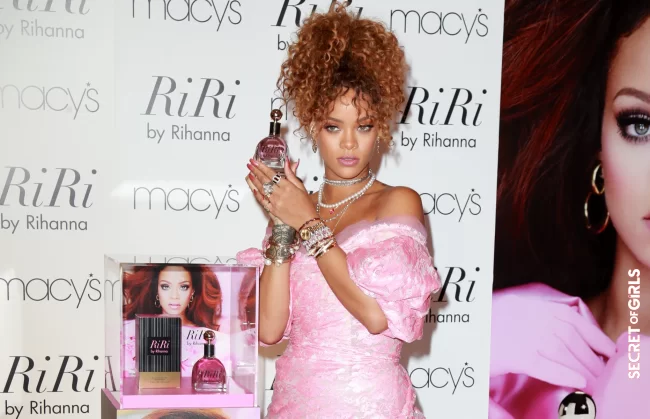 Long honey curls pulled up into a high ponytail for the presentation of her perfume Riri in New York in 2015 | Rihanna's All Hairstyles So Far - Discover Rihanna's Hair Evolution