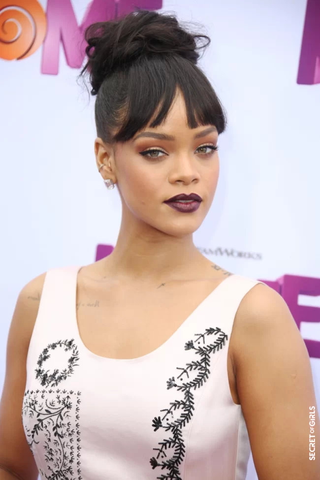 Loose bun and long bangs, at the `Home` movie premiere in Los Angeles in 2015 | Rihanna's All Hairstyles So Far - Discover Rihanna's Hair Evolution
