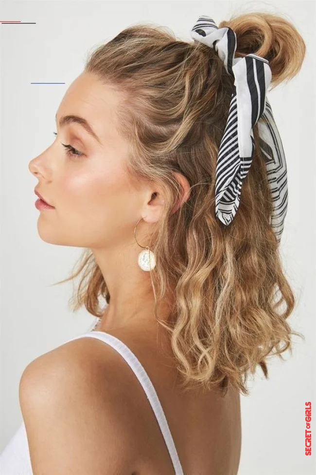 Bun tied with a scarf | Hairstyle Trends Fall 2023: 12 Perfect Hairstyle Ideas For Curly Hair
