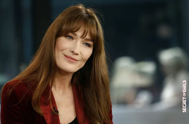 Carla Bruni and her long hair with auburn highlights, on the set of the Today Show in 2013 | Carla Bruni: Her Beauty Evolution In 50 Looks