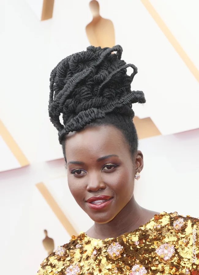 Lupita Nyong'o wears her hair in a statement updo and has glowing skin | Oscars 2022: These are The Best Beauty Looks on The Red Carpet