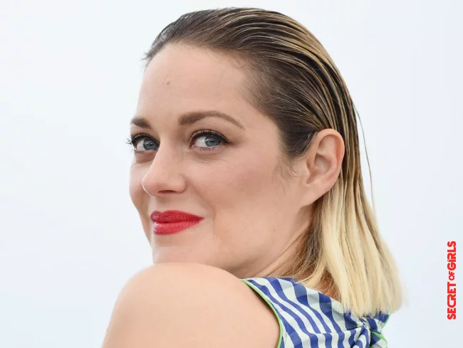 Marion Cotillard has her hair combed back and wears the roots in a wet look. | Hairstyle Trend: Fascinating Slick Look and Wet Hair Look