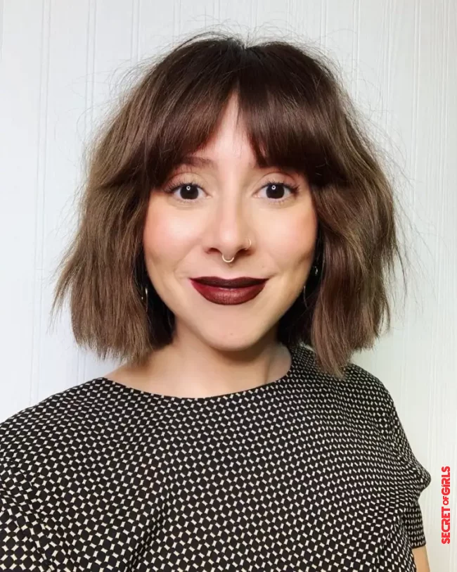 Curtain bangs go perfectly with the chin-length choppy bob | Chin-Length Choppy Bob is One of The Coolest Hairstyles for Spring 2023
