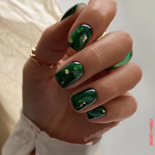 4. Dark green nail polish with an artful design | Nail Polish Trend In Winter 2023: Dark Green Is The Trend Color