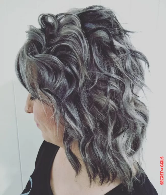 For dark hair, steel gray locks distributed over the entire head in broad bands | Most Beautiful Shades Of Coloring For Gray Hair