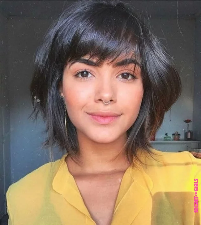 Chic hairstyle with stranded bangs | Layered Bob With Bangs: Chic Variations on the Most Popular Hairstyle Trend of 2023